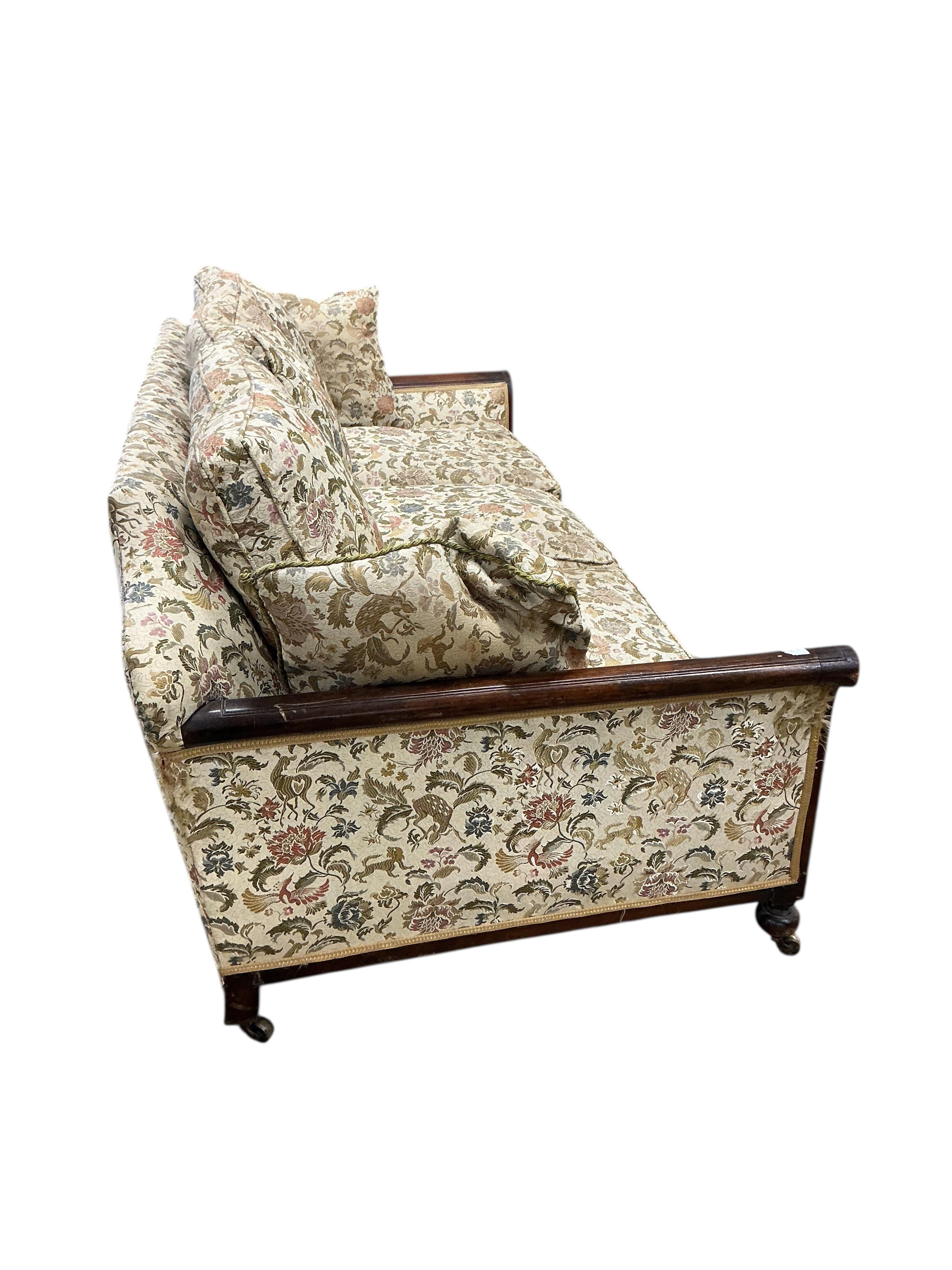 An early 20th century mahogany bergere settee, now upholstered, width 196cm, depth 92cm, height 84cm